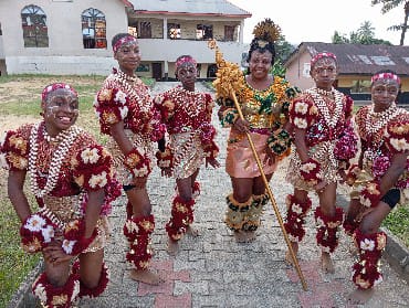 Young people in traditional dress performing together